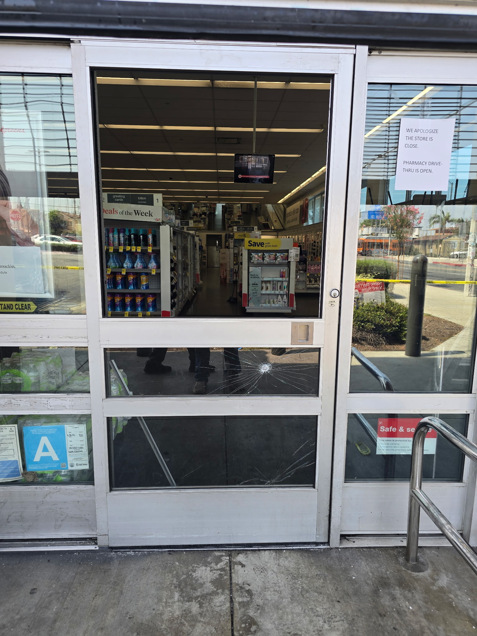 Smashed storefront door before